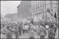 Alternate view of students behind the Southern Student Organizing Committee banner reaching 14th St NW and Pennsylvania Ave NW during a protest march against Nixon's inauguration and the Vietnam War, 19 January 1969