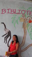 Gabina stands in front of the mural at the library, El Plátano, Panama